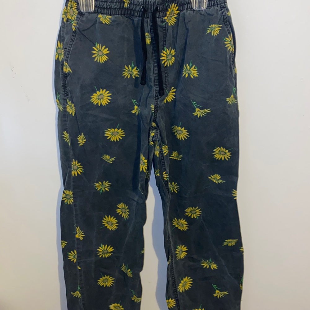 Vans, men’s size S, black joggers with sunflowers.